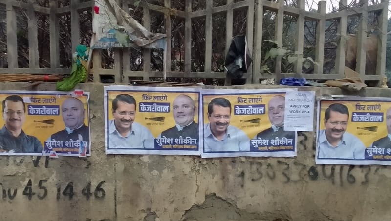 Political outfits defacing public property by pasting their posters on walls before the Delhi Assembly Election 2025. Photo: Rakesh Raman / RMN News Service